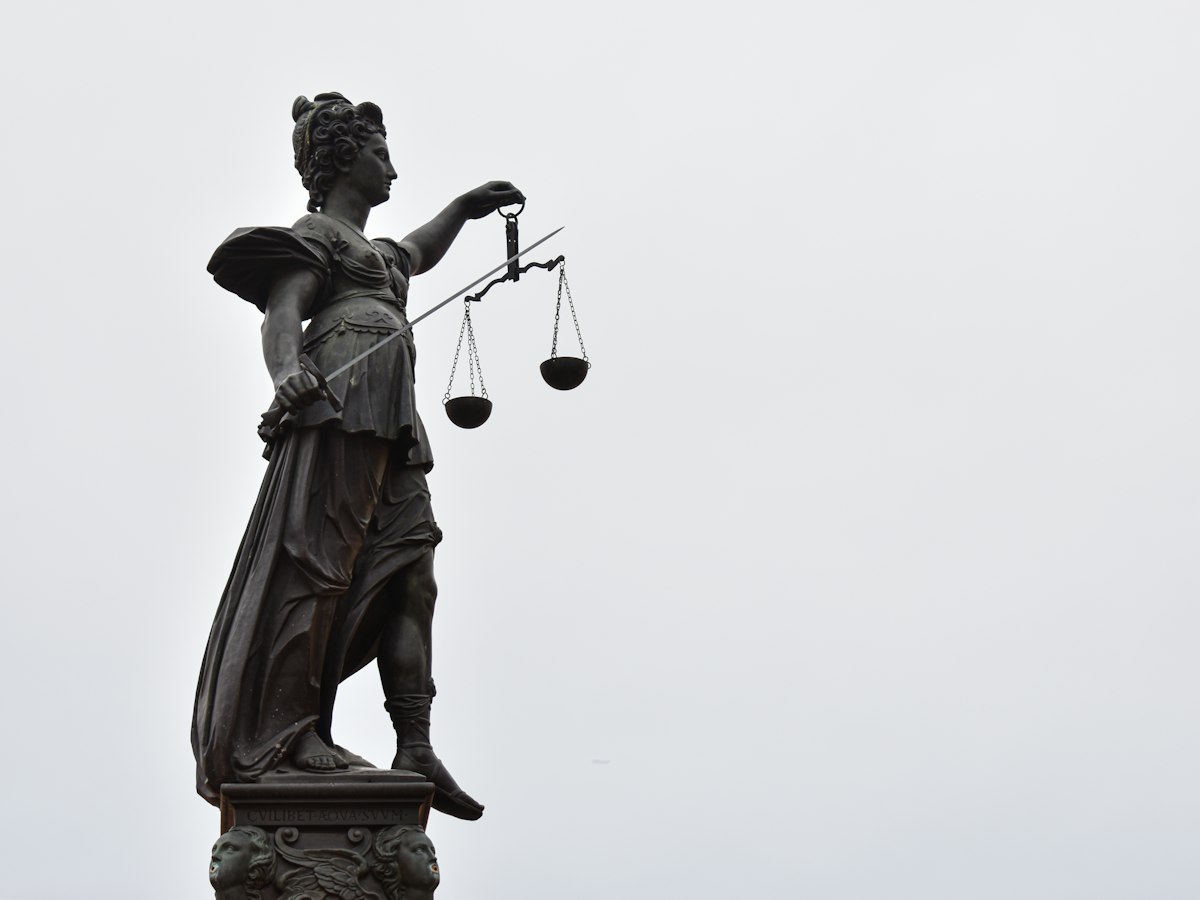 A statue of Lady Justice holding the scales of justice